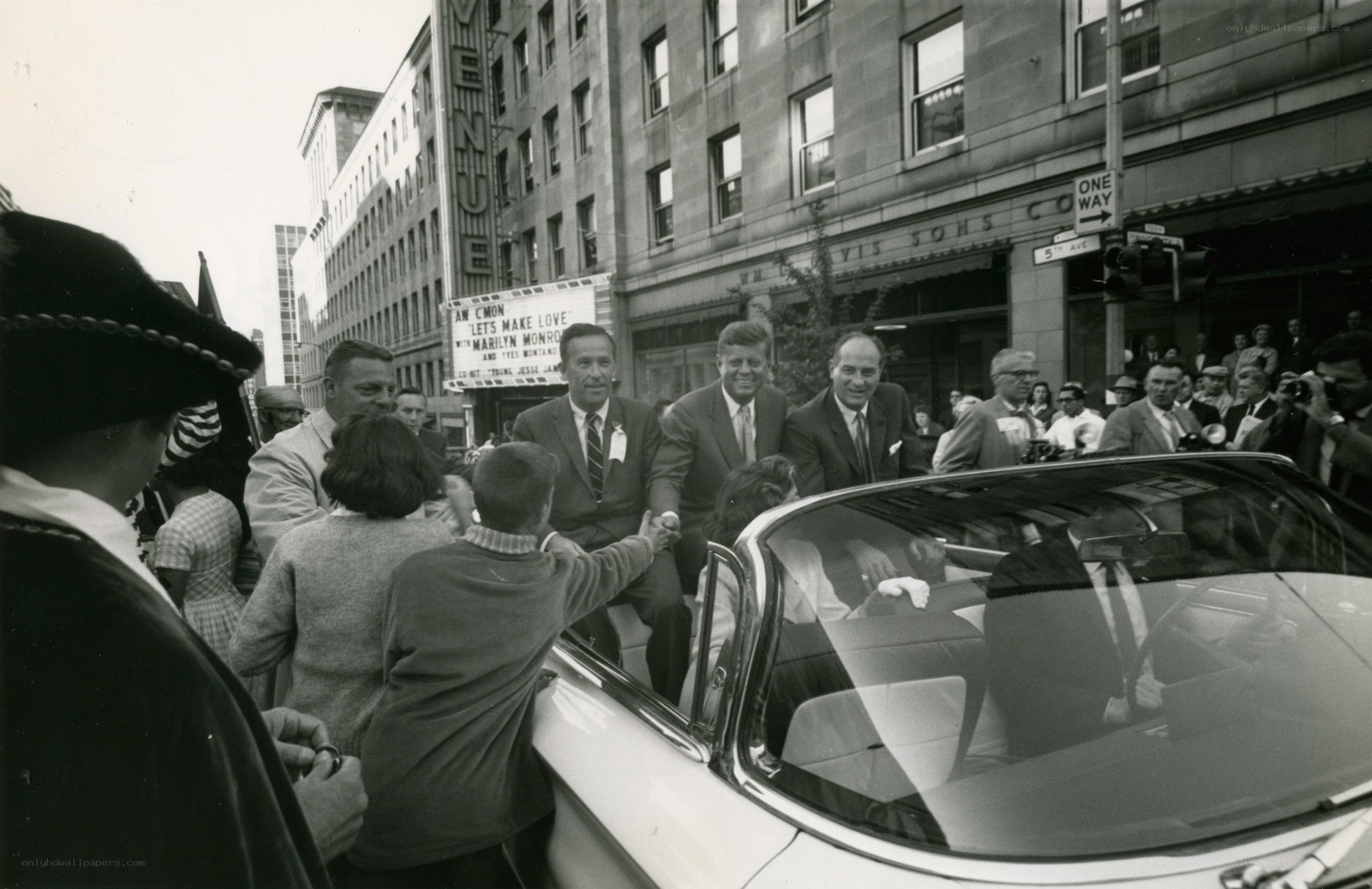 Kennedy in a convertible car