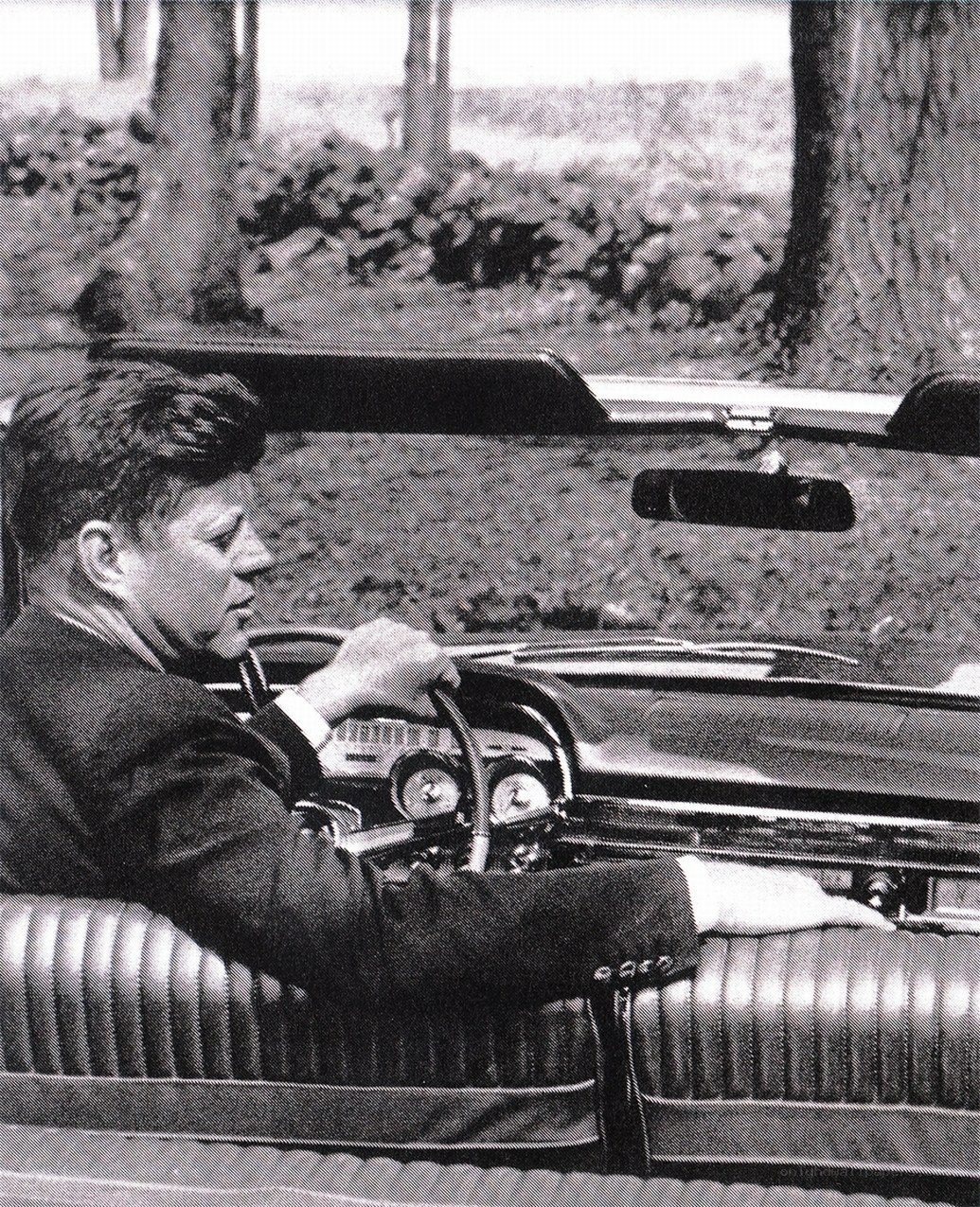 Kennedy in a convertible car
