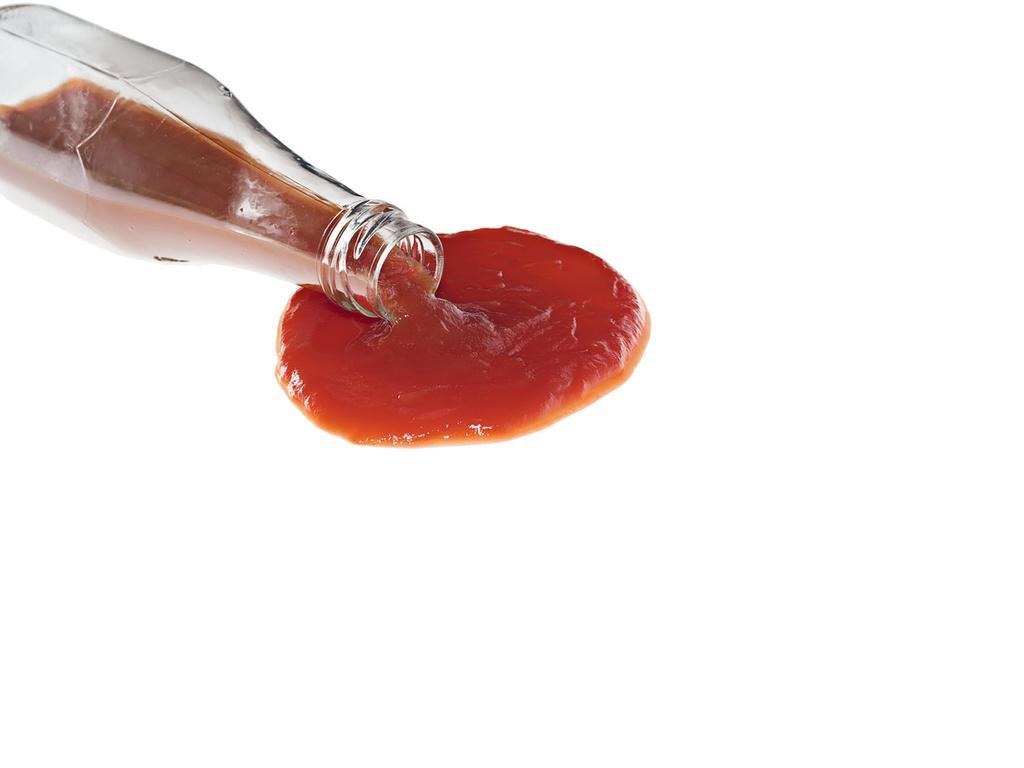 ketchup being poured from bottle
