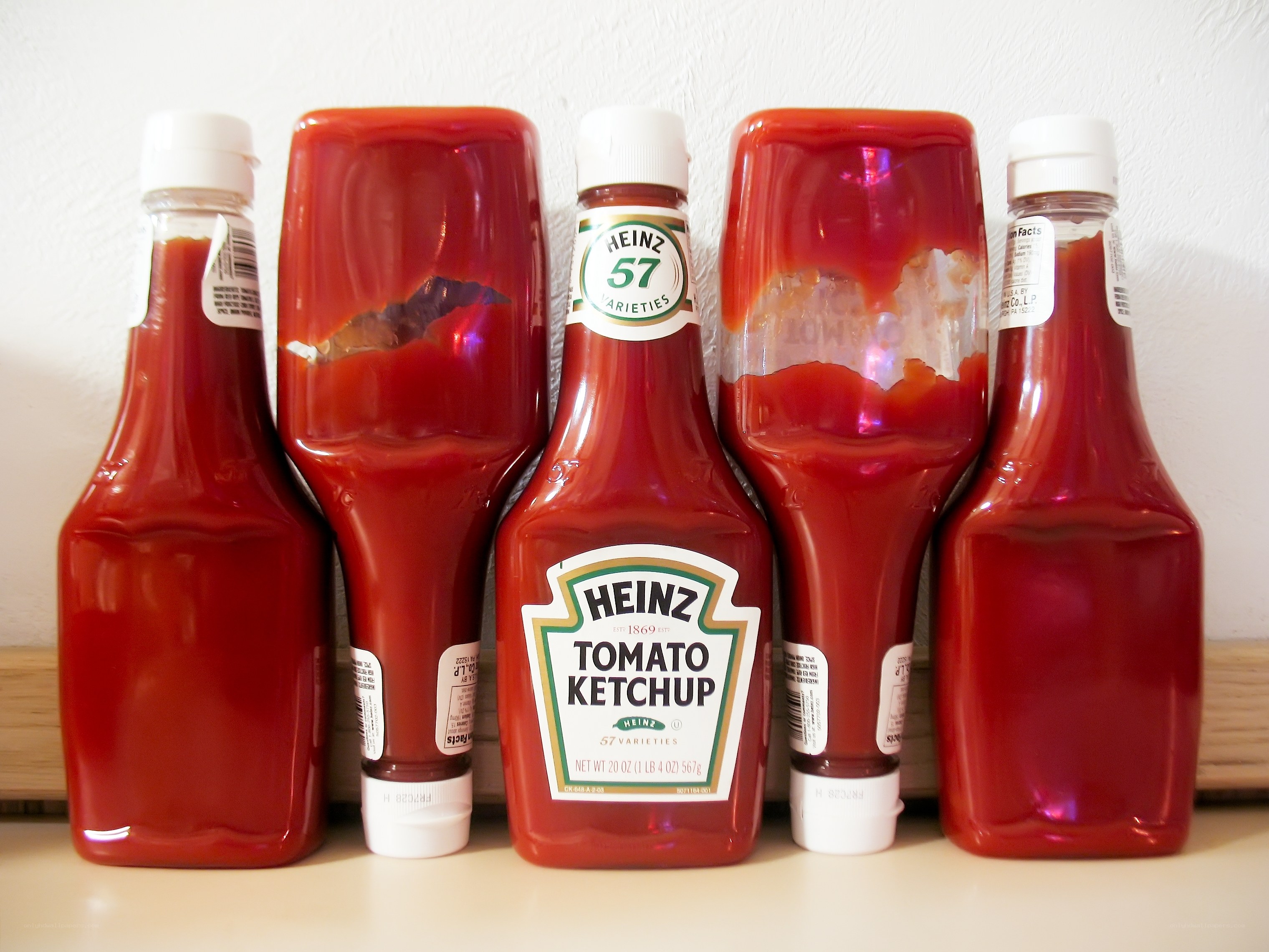 ketchup bottles on a counter