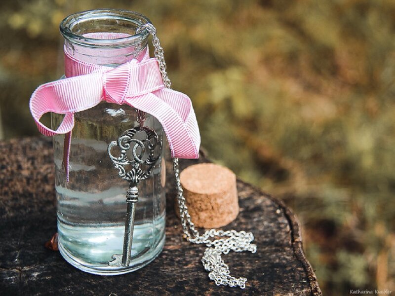 Key in Glass Bottle
