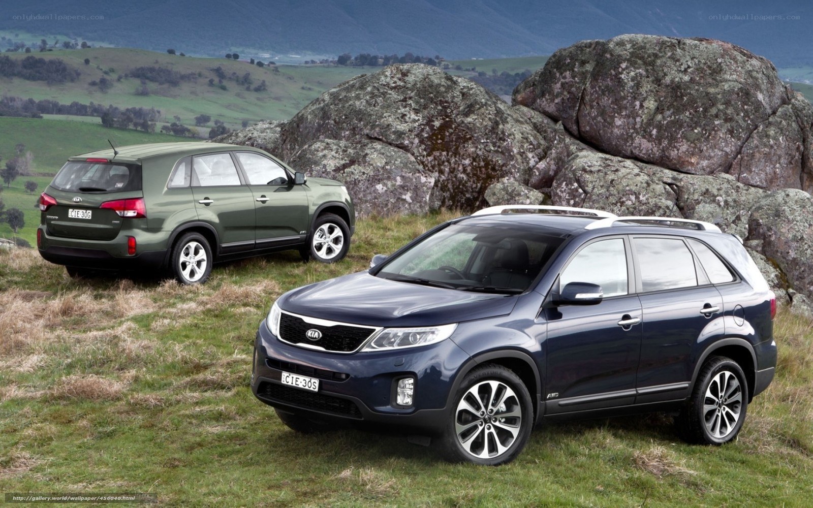 Kia SUVs in a scenic landscape