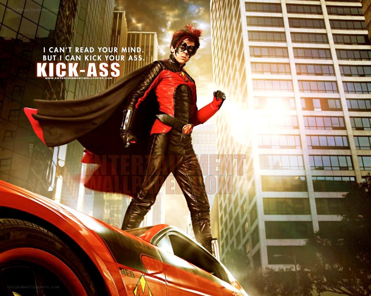 Kick-Ass superhero standing on car