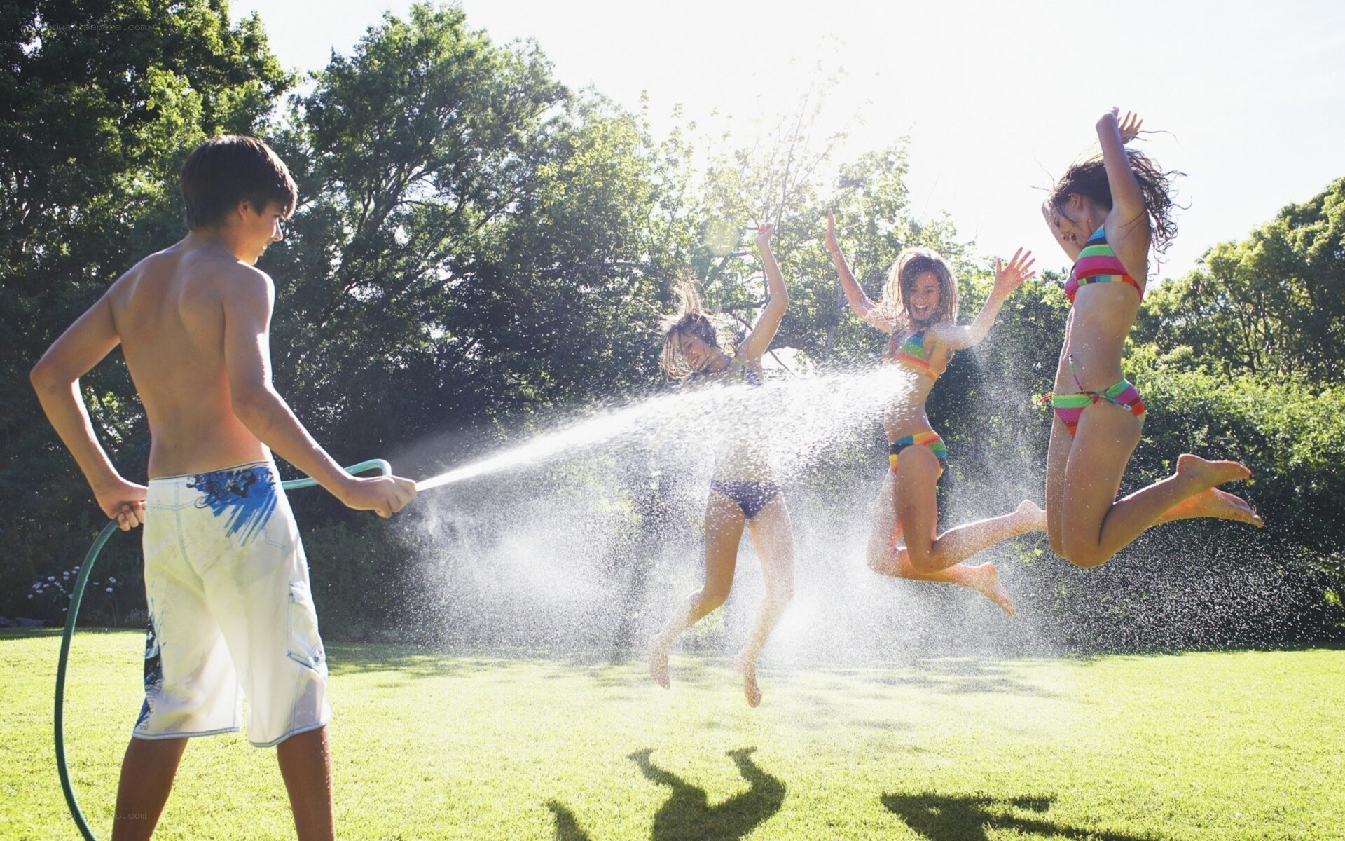 Kids playing with garden hose