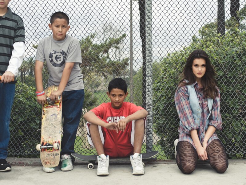 Kids with skateboards in park