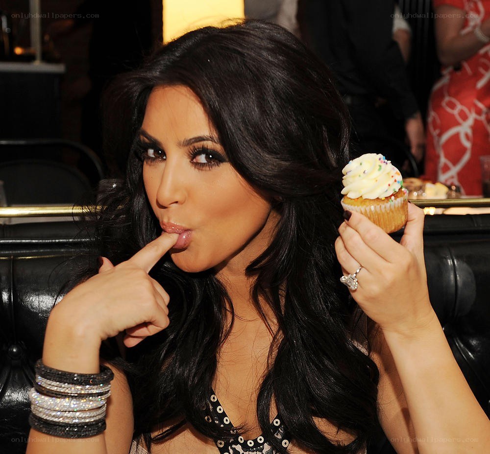 Kim Kardashian holding a cupcake