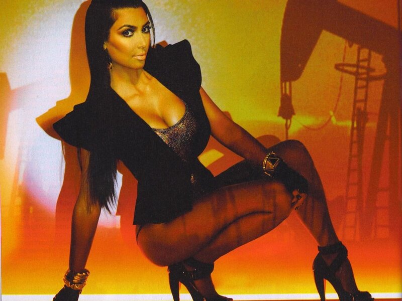 Kim Kardashian posing in black outfit