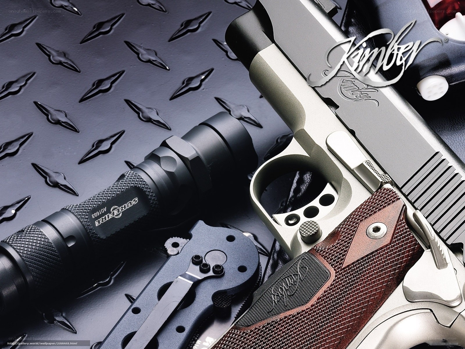 Kimber pistol with flashlight and knife