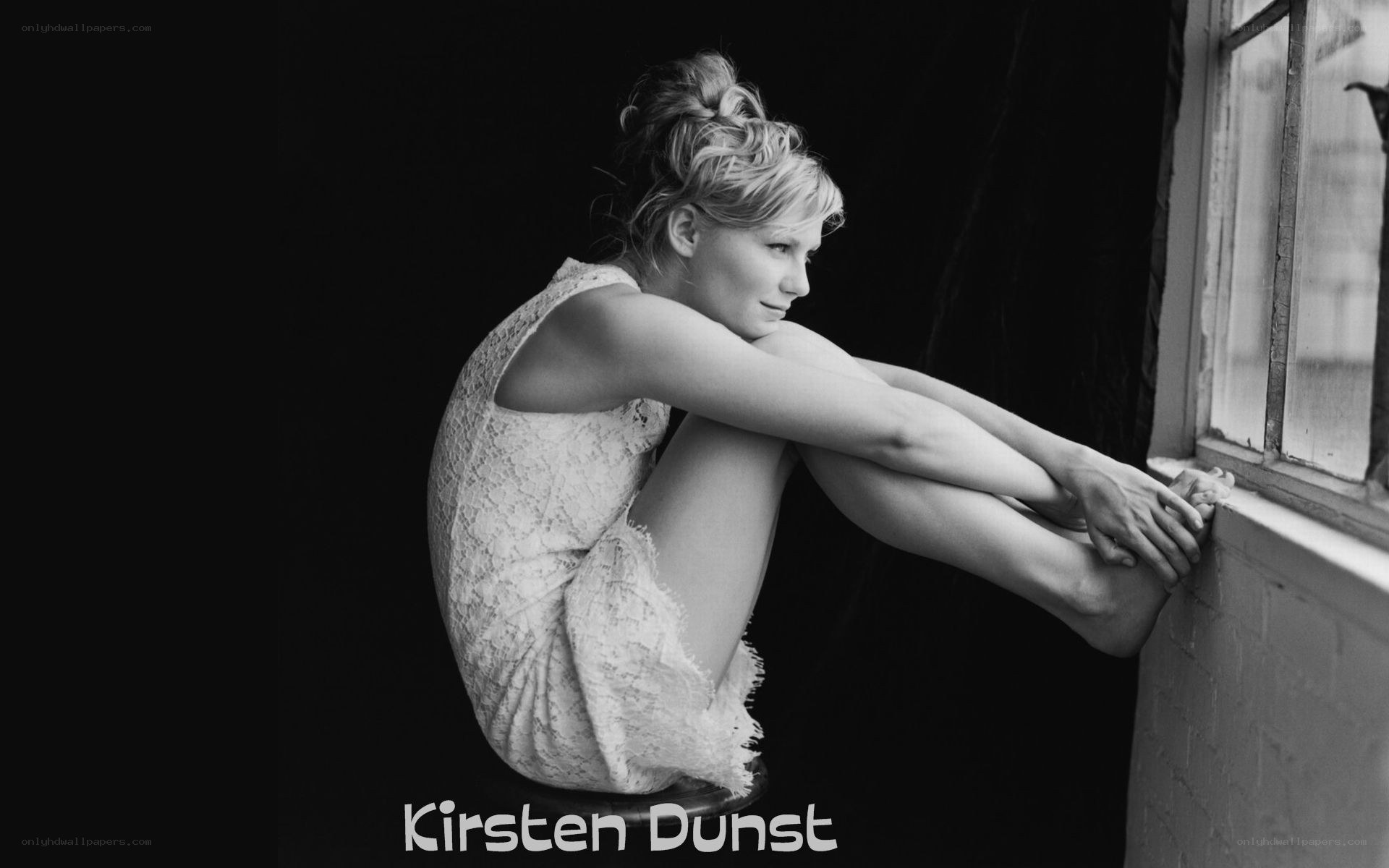 Kirsten Dunst by window