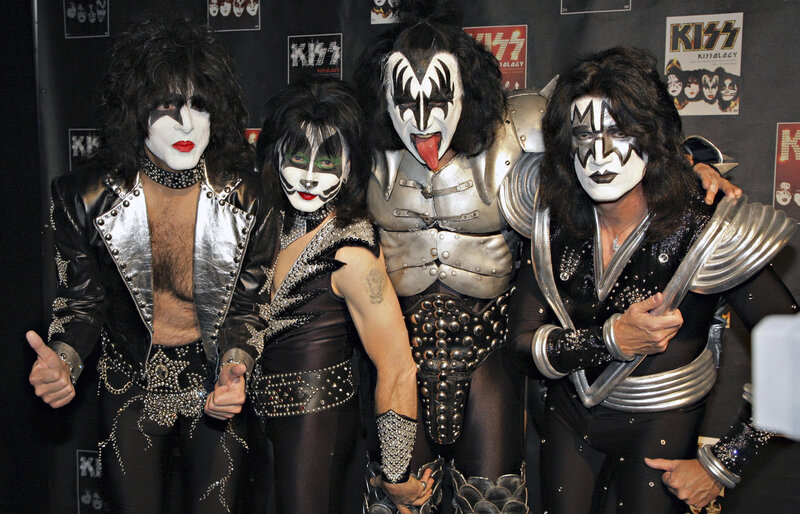 KISS band members posing