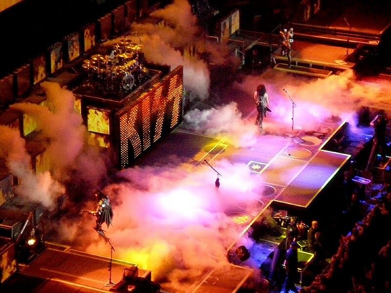 KISS Band Performing on Stage — Purple