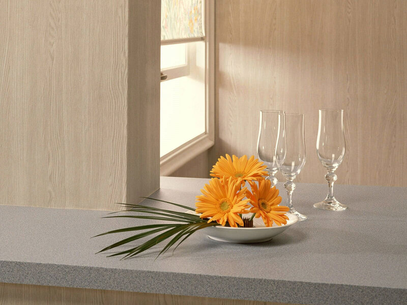 Kitchen counter with flowers and glasses