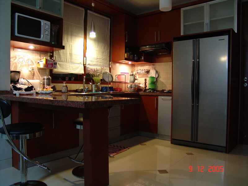kitchen with bar and refrigerator