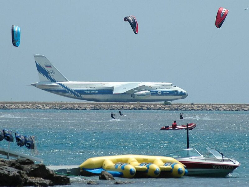 Kite surfers near large airplane