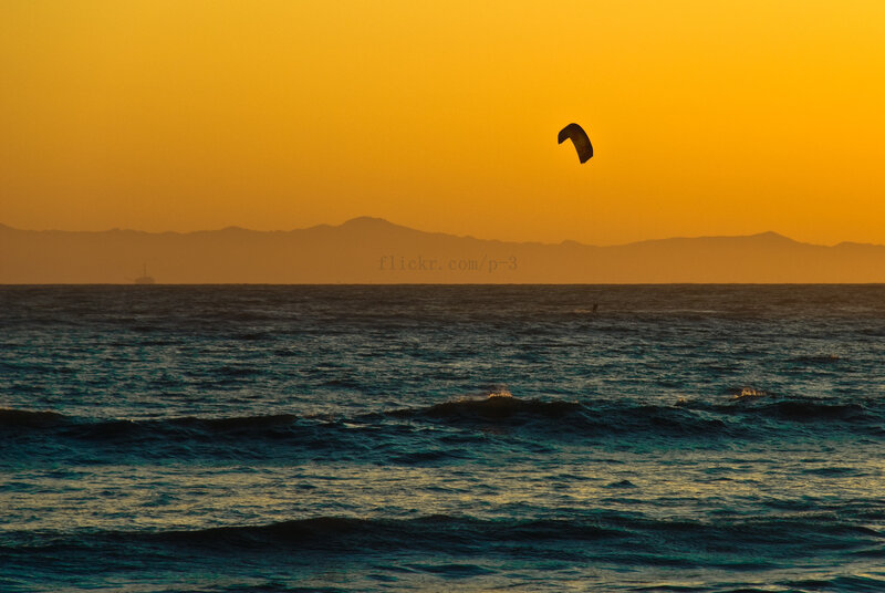kite surfing at sunset