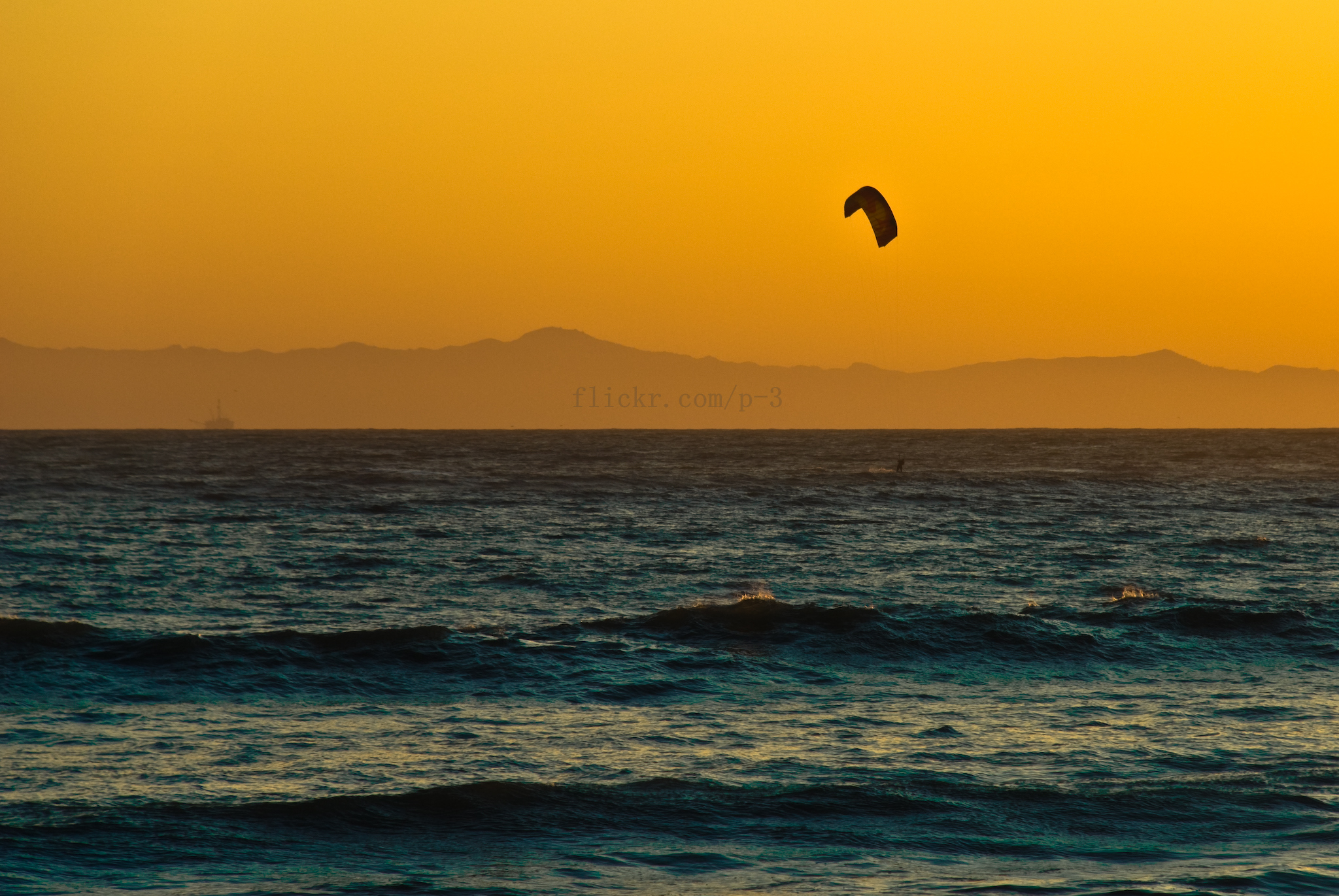 kite surfing at sunset