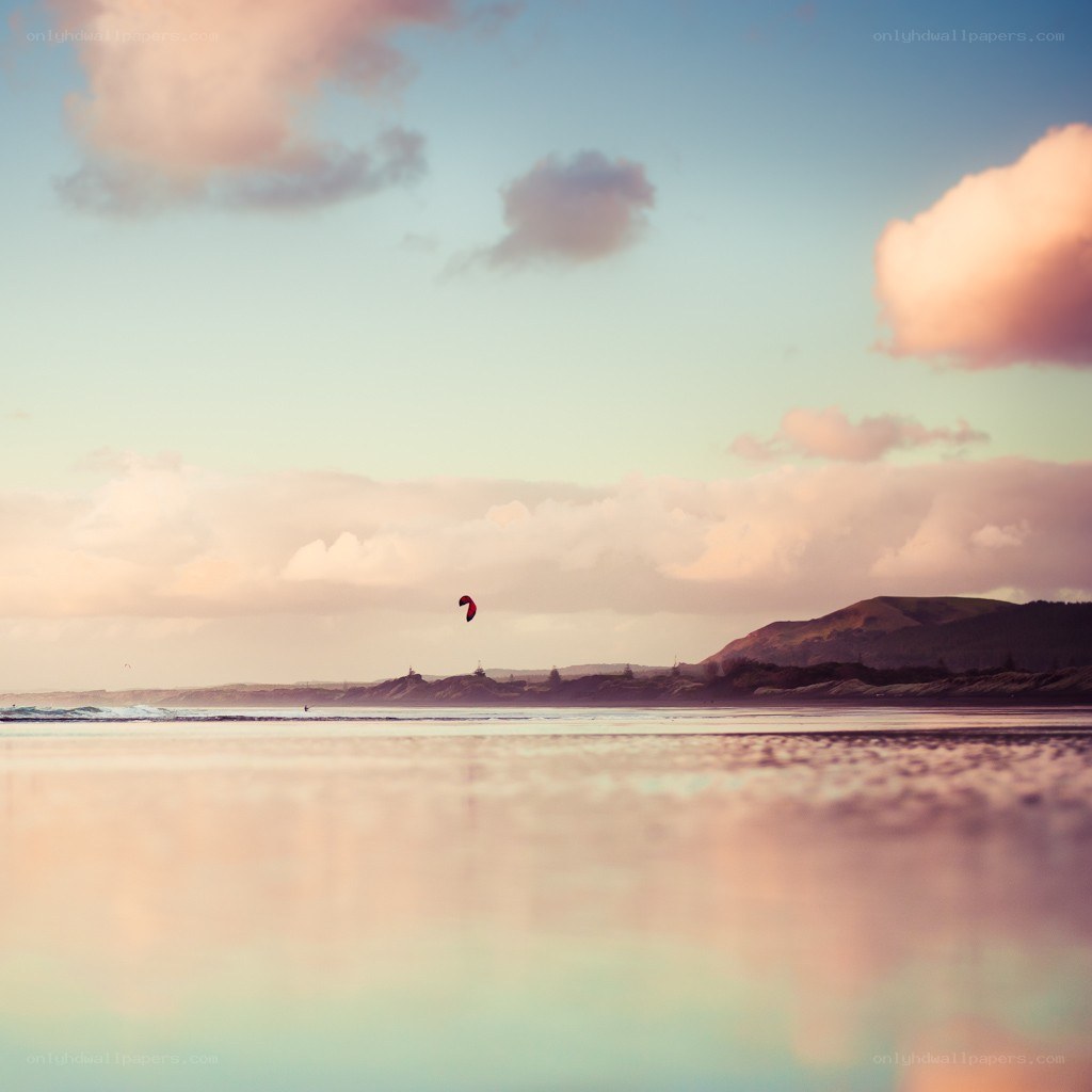 Kite surfing at sunset