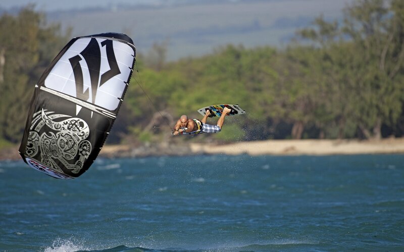 Kiteboarder in Mid-air — Blue, Dynamic, Afternoon