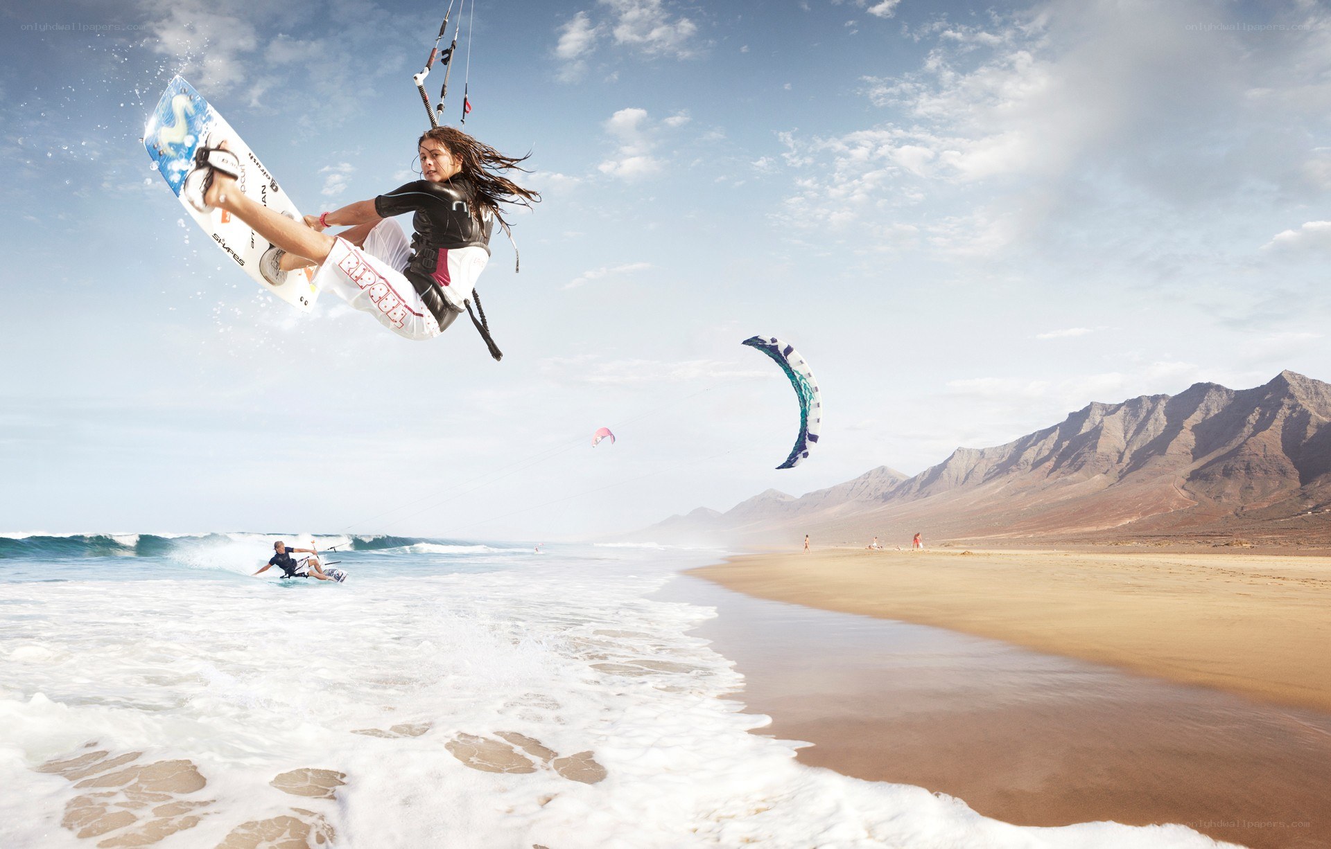 Kiteboarder performing aerial trick