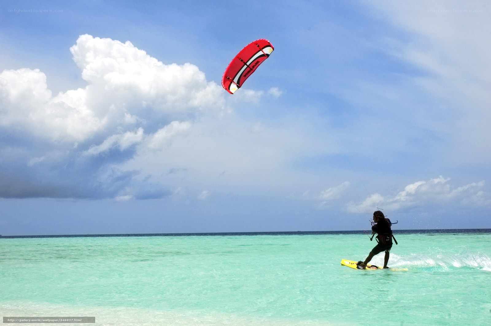 kiteboarding in turquoise water