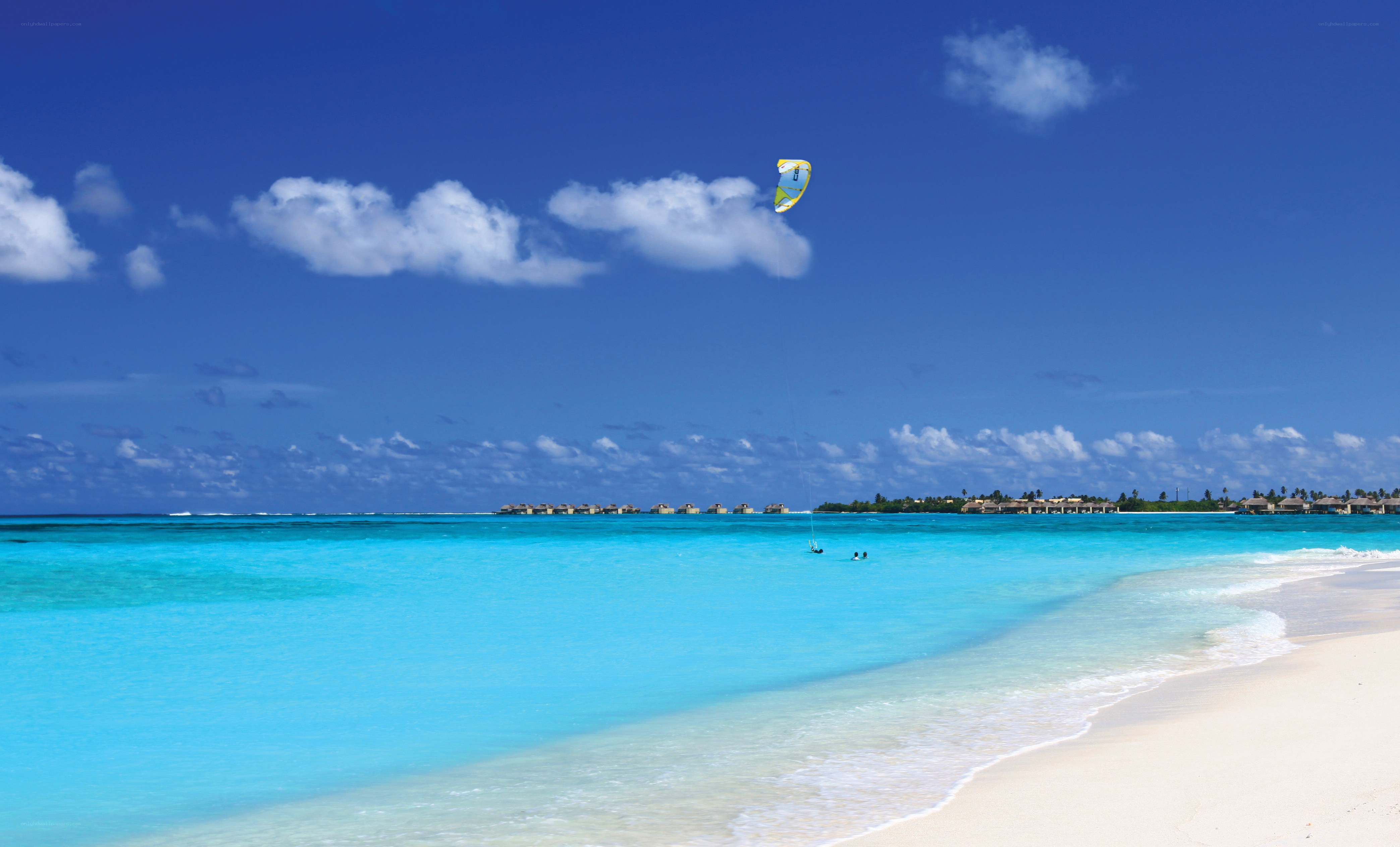 Kiteboarding over turquoise waters
