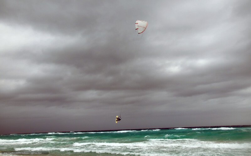 kiteboarding under stormy sky