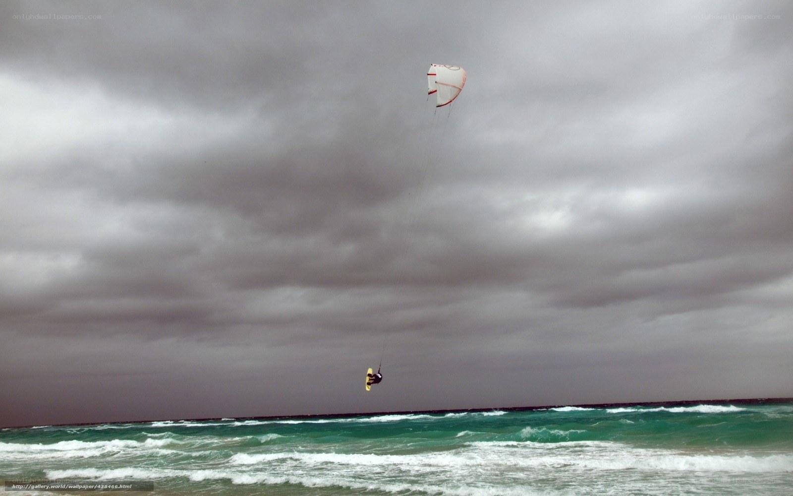 kiteboarding under stormy sky