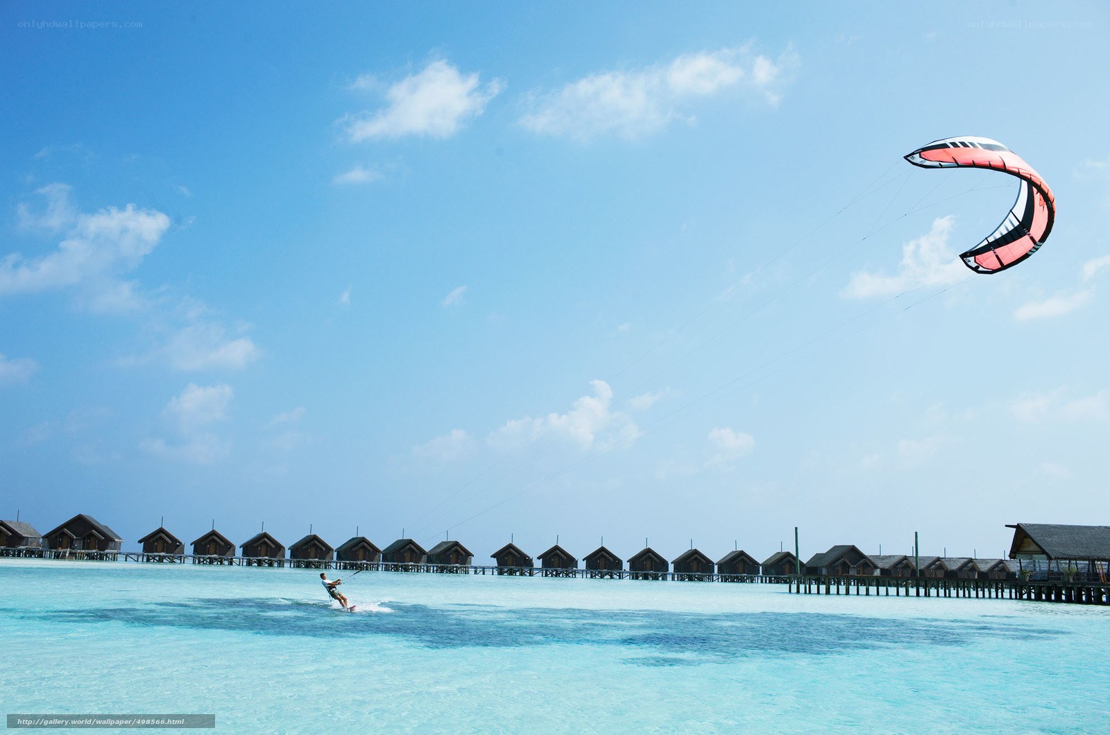 kitesurfer over tropical resort