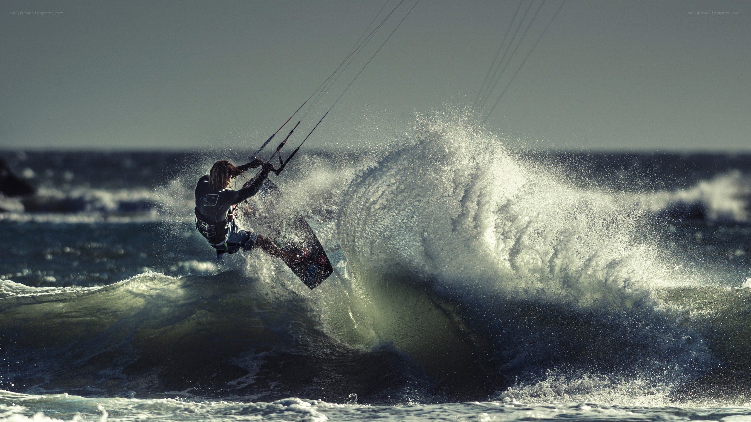 kitesurfer riding wave