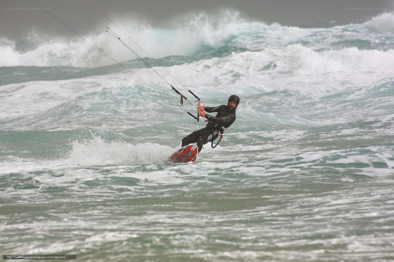 kitesurfer riding waves