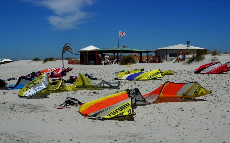 Kitesurfing gear on a sunny beach