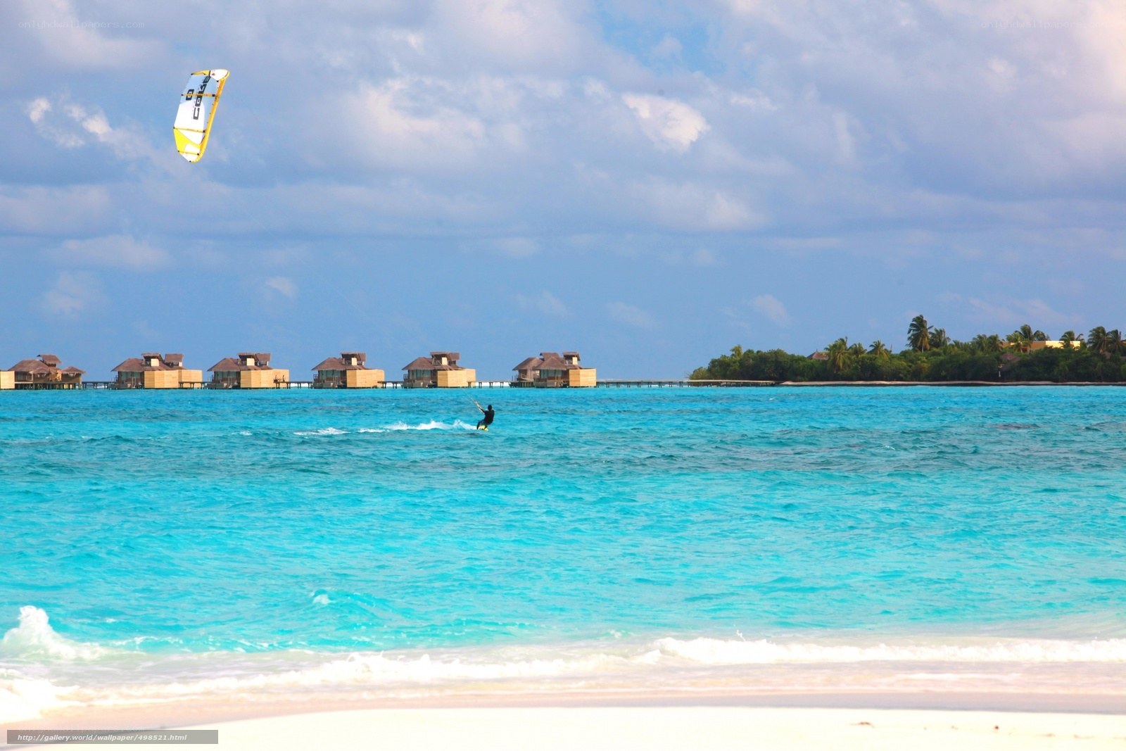 kitesurfing over turquoise water