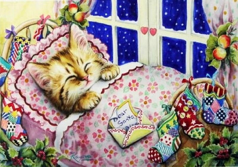 Kitten Sleeping in Bed