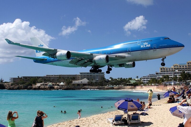 KLM plane landing over beach