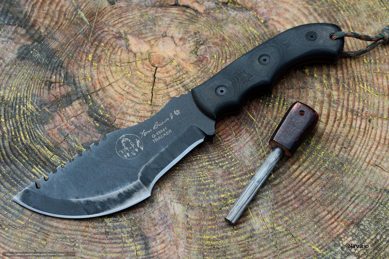 knife and fire starter on wood