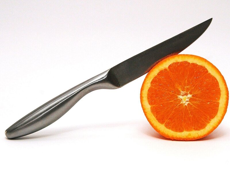 knife and orange slice