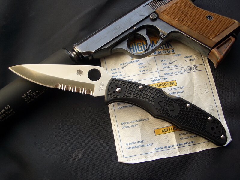 Knife and pistol on document