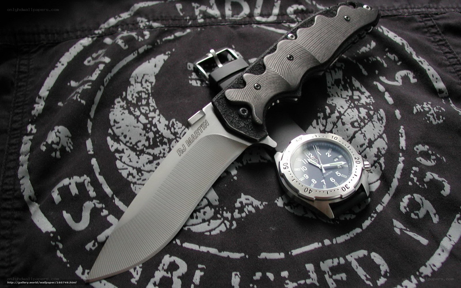 knife and watch on fabric