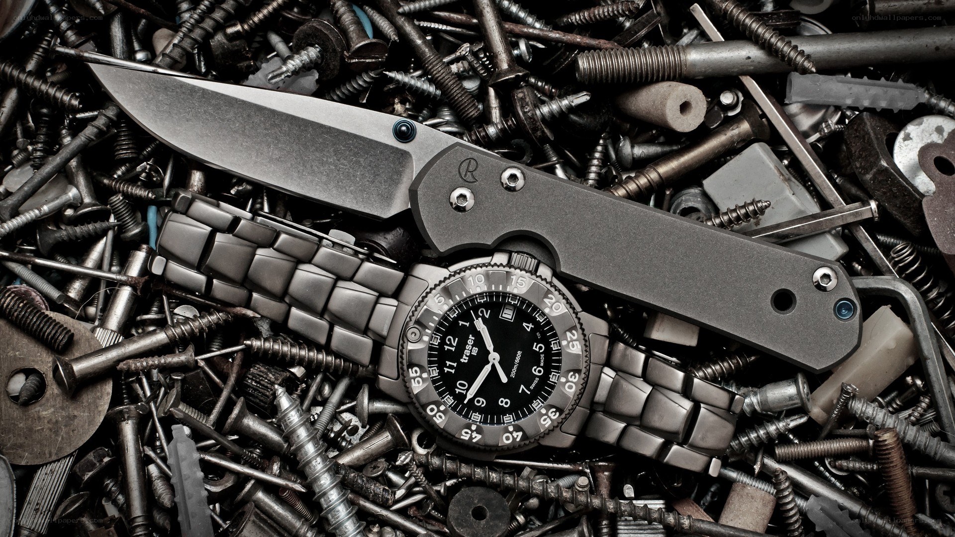knife and watch on screws