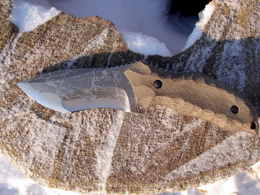 knife on snowy rock