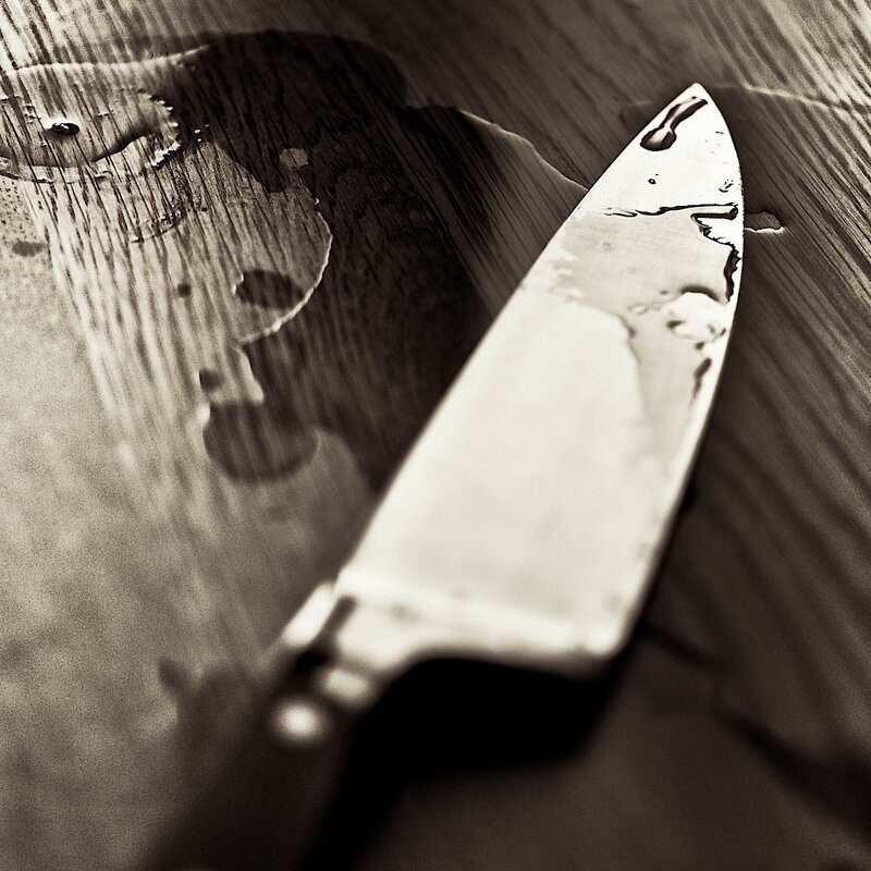 Knife on Wooden Surface — Black
