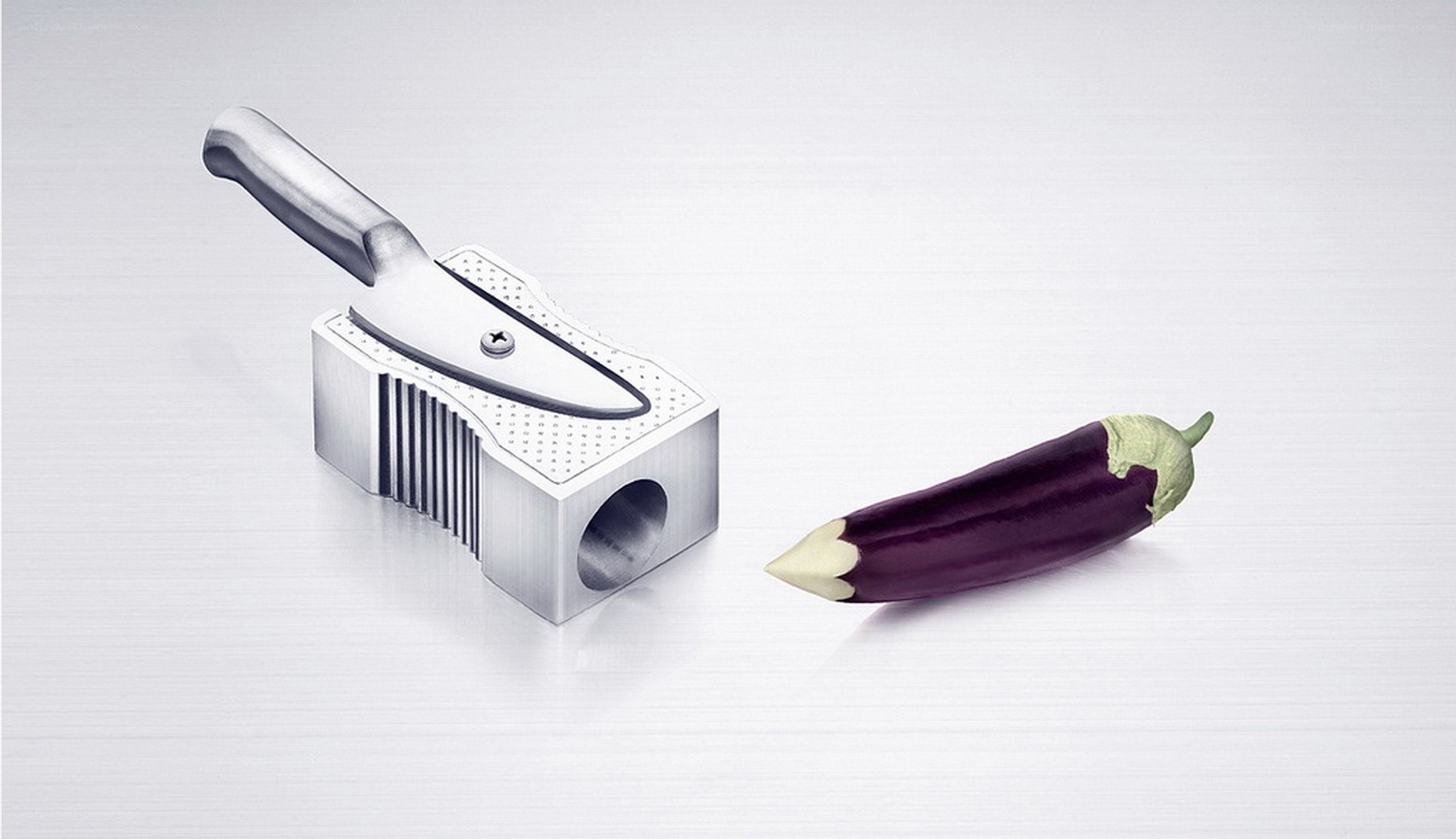 Knife-shaped pencil sharpener with eggplant