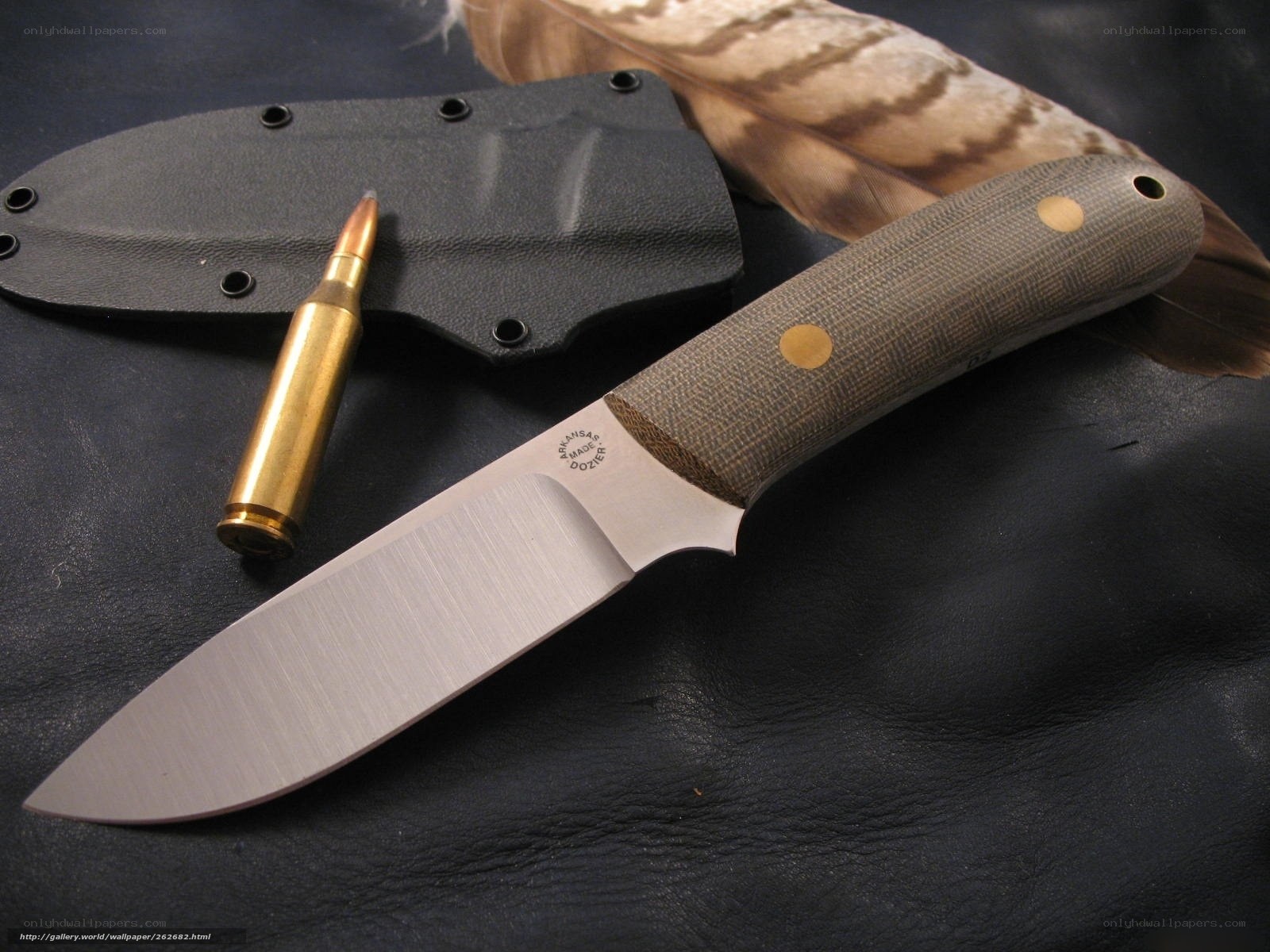 knife with bullet and feather
