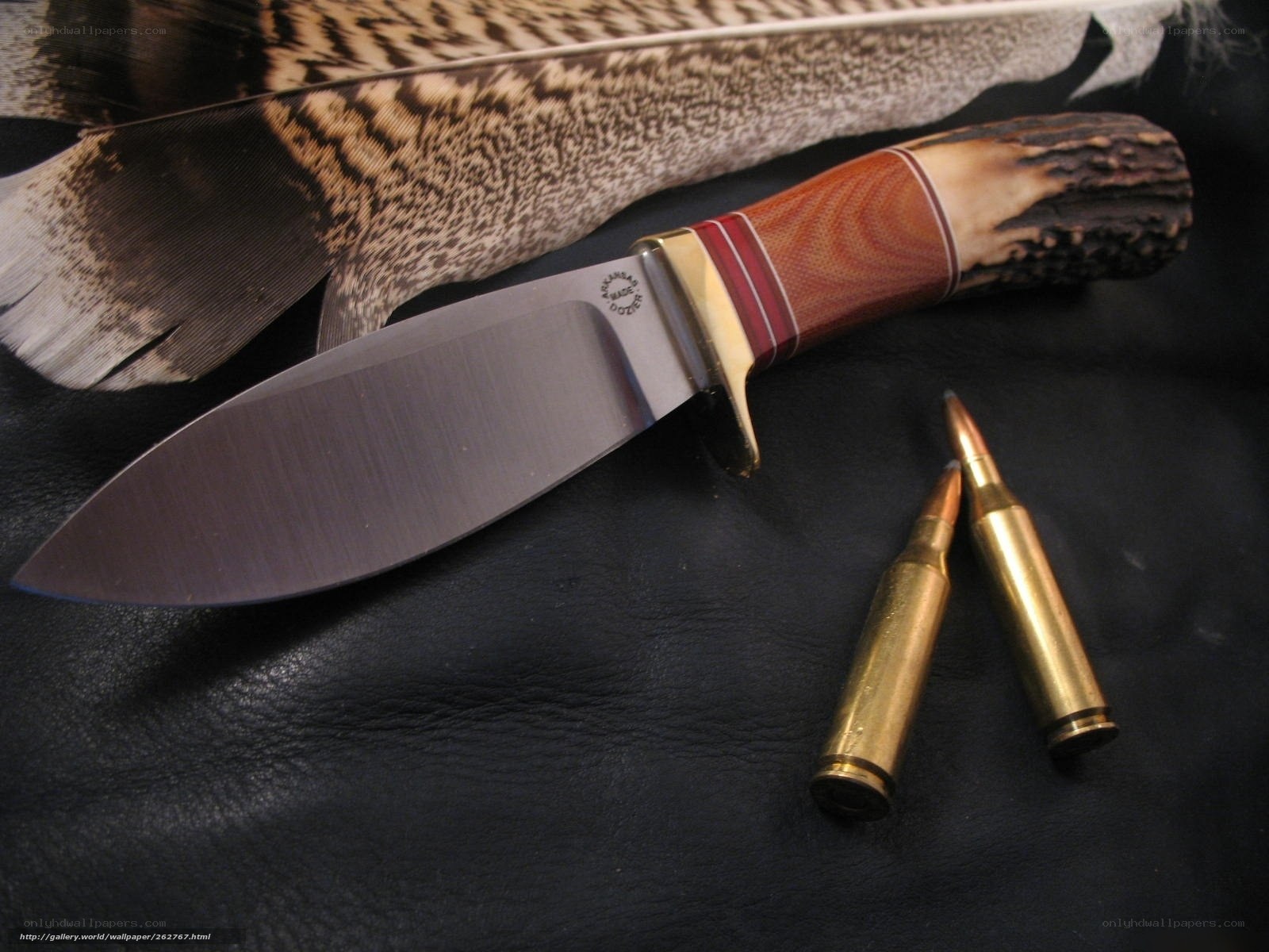 knife with bullets and feather