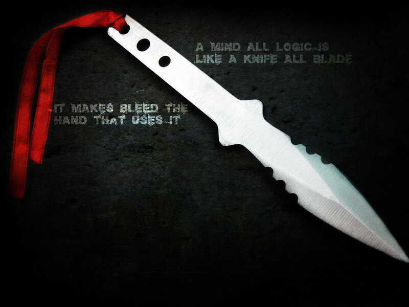 knife with red ribbon