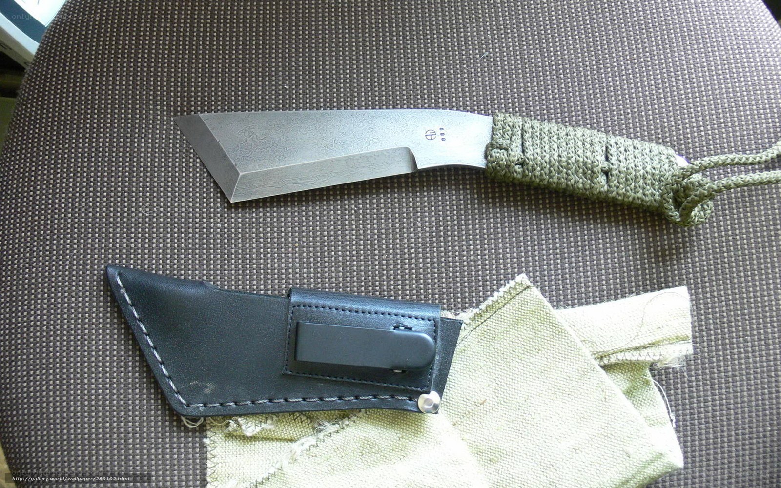 knife with sheath on fabric