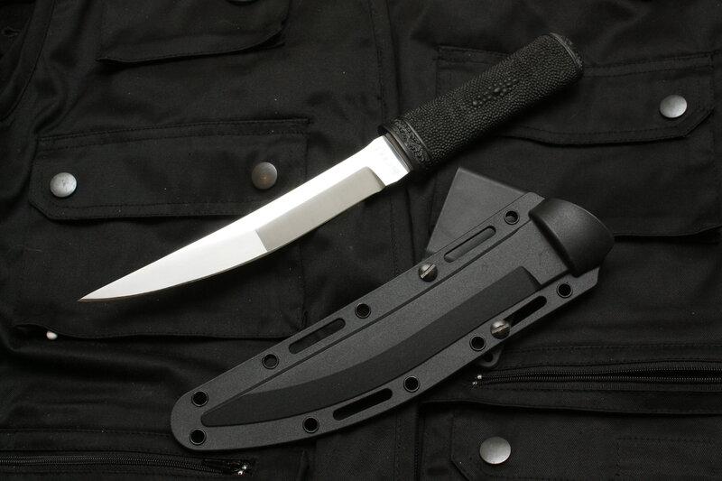knife with sheath on vest