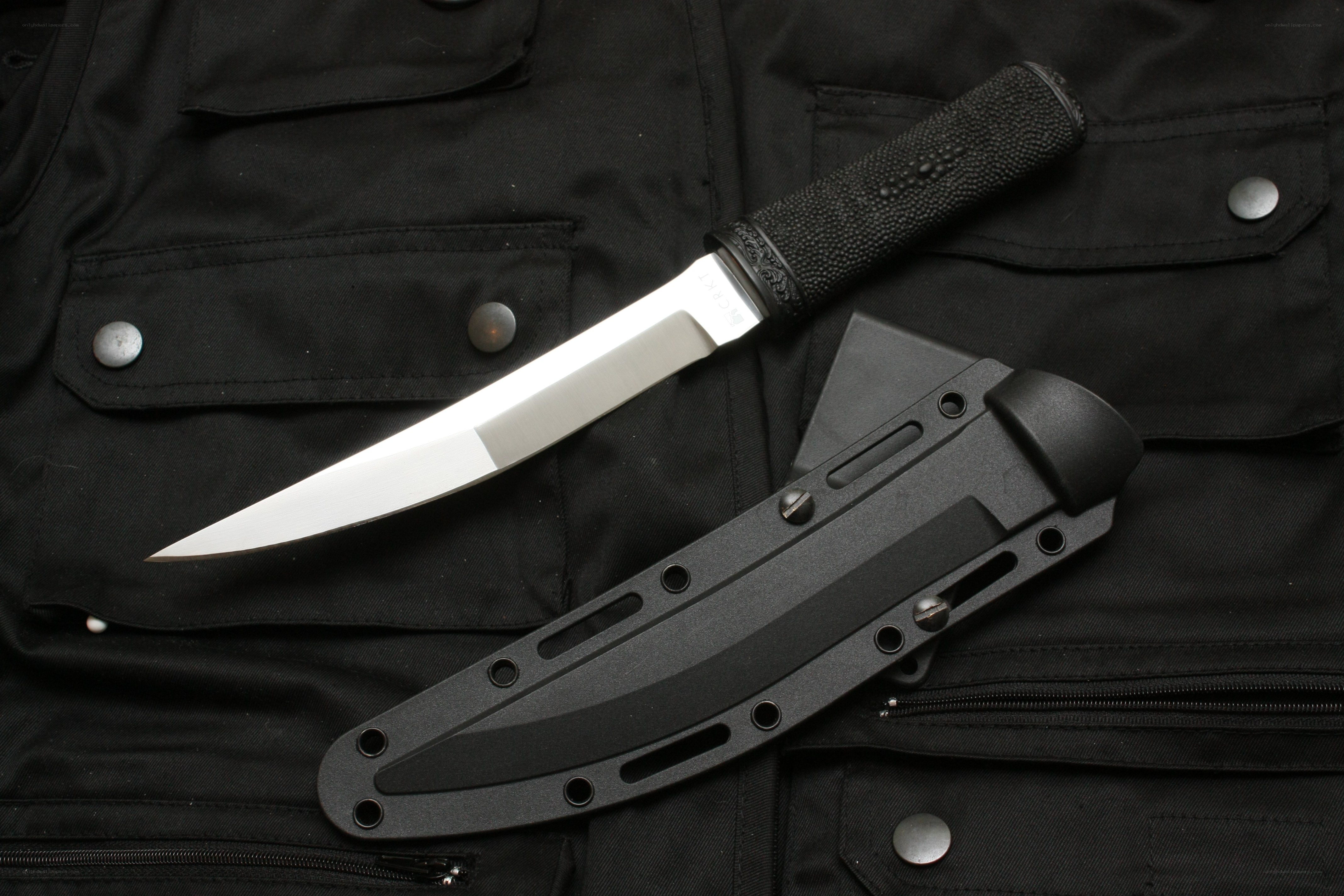 knife with sheath on vest