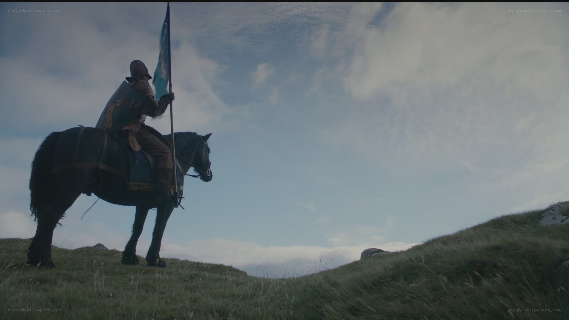 knight on a hill with flag