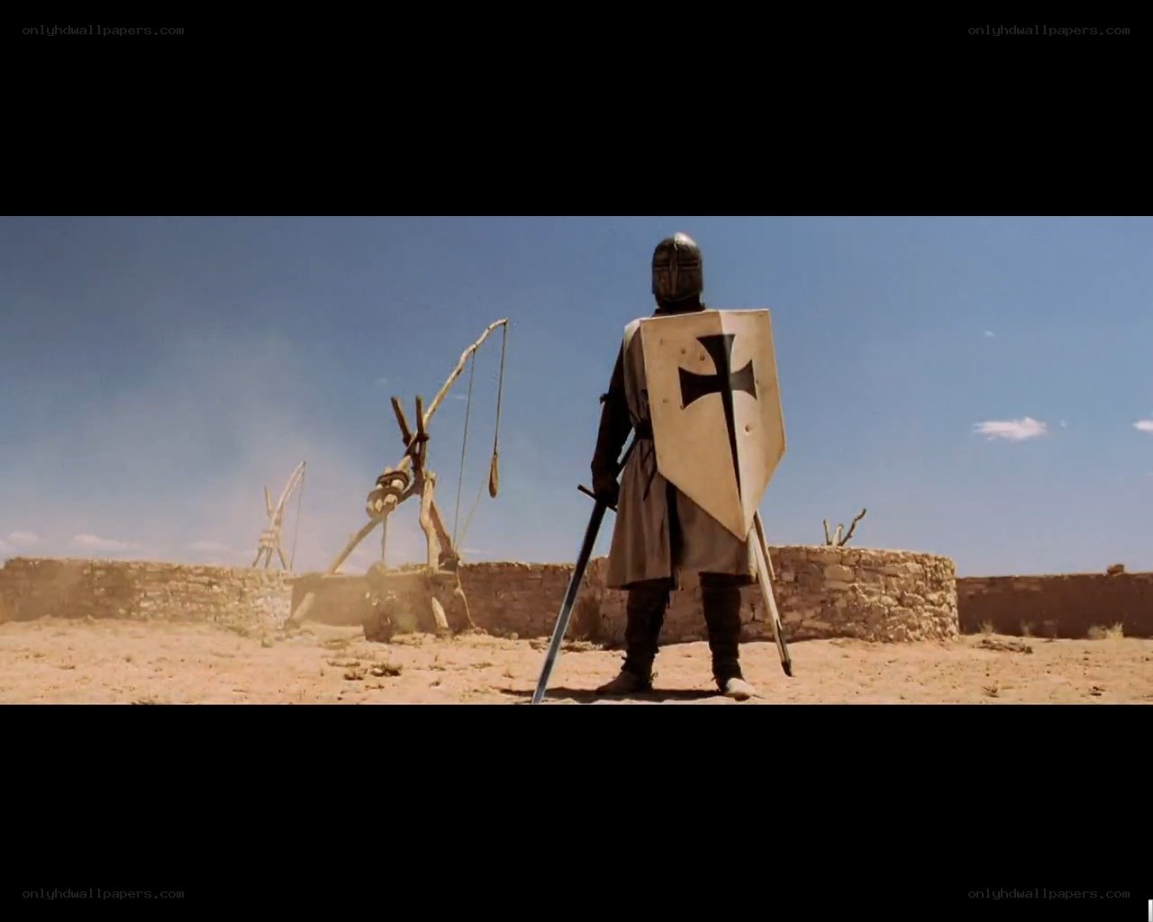 knight stands before siege